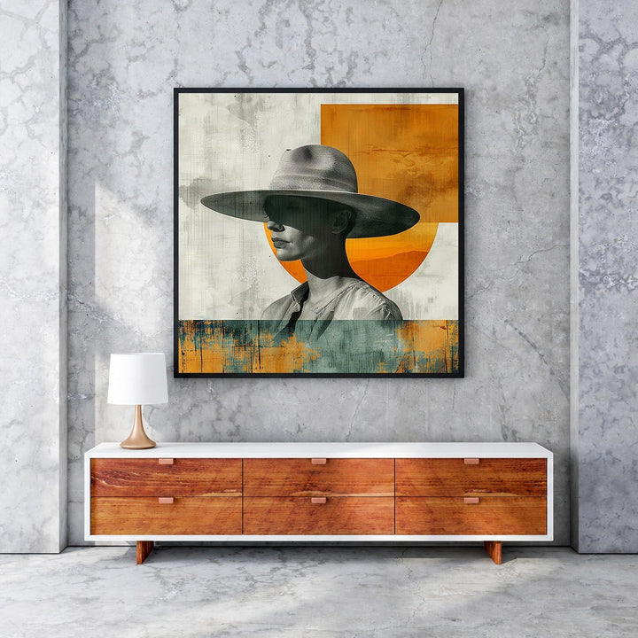 Wadi Home abstract portrait art with a figure wearing a wide-brimmed hat, featuring muted tones and orange accents.