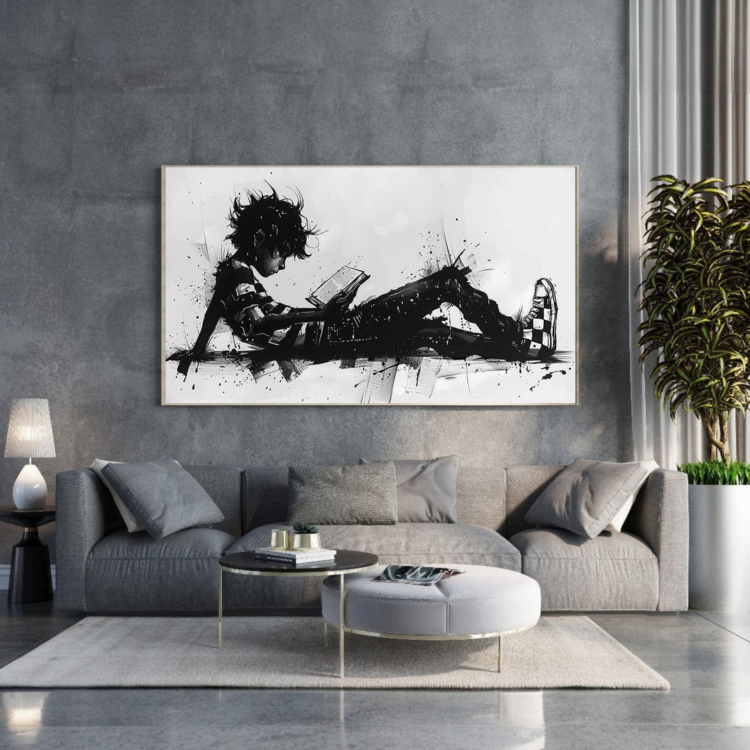 Wadi Home abstract black and white wall art of a child reading a book, with dynamic brushstrokes and ink splatters.