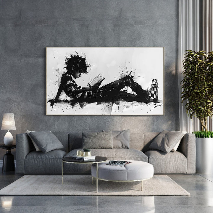 Wadi Home abstract black and white wall art of a child reading a book, with dynamic brushstrokes and ink splatters.