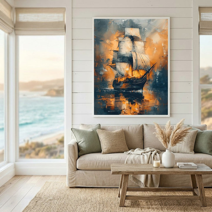 Wadi Home abstract sailing ship wall art in navy and amber sunset tones, displayed in a coastal living room.