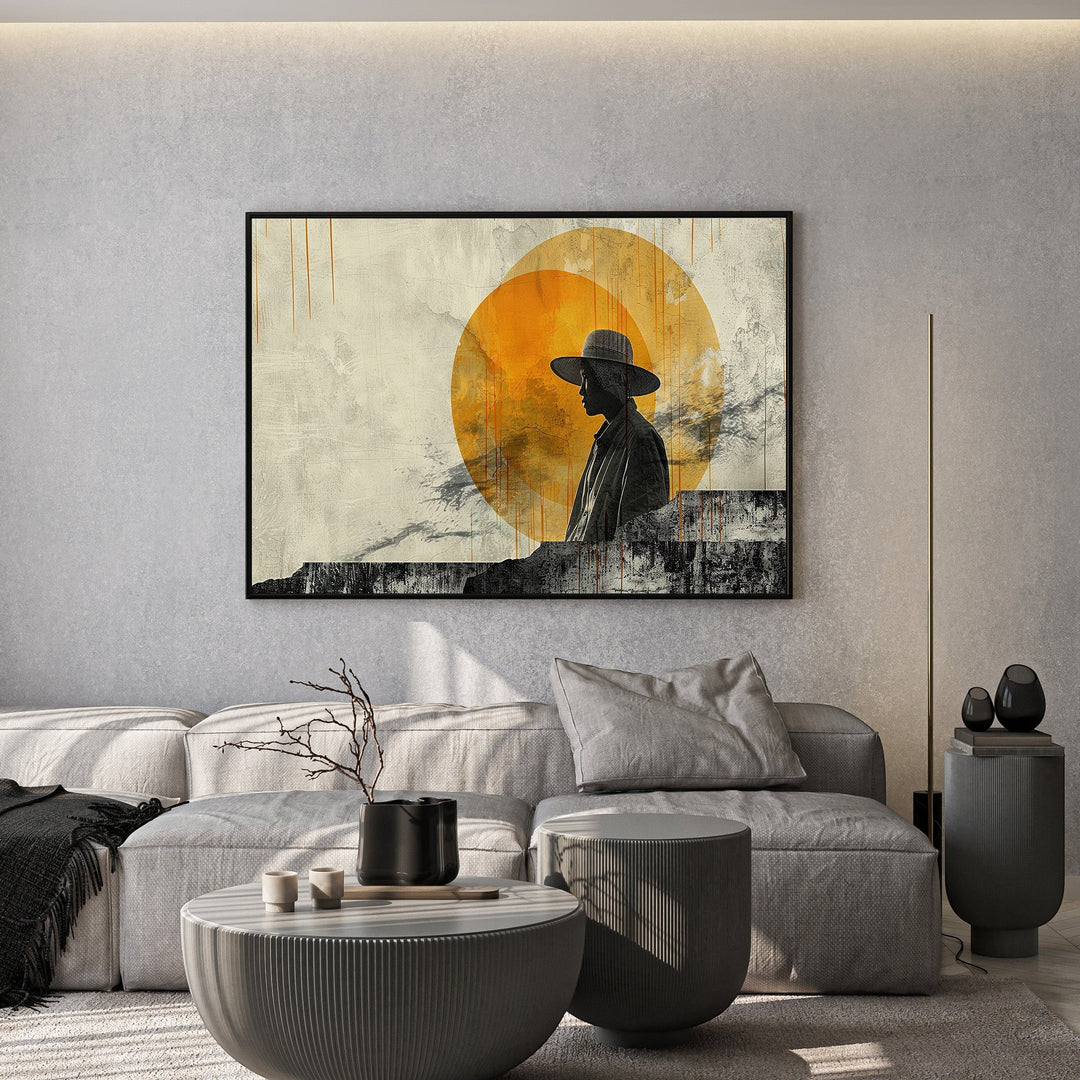 Wadi Home abstract silhouette wall art print featuring a person in a hat against a golden sun in a modern living room