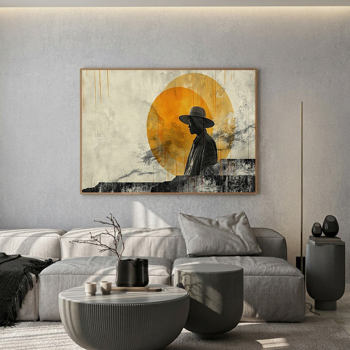 Wadi Home abstract silhouette wall art print featuring a person in a hat against a golden sun in a modern living room