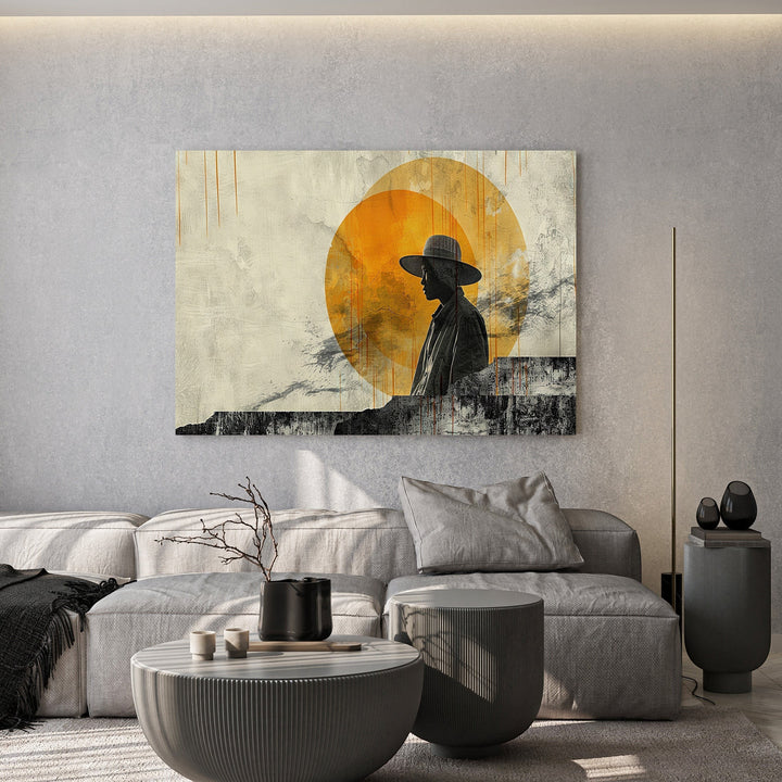 Wadi Home abstract silhouette wall art print featuring a person in a hat against a golden sun in a modern living room