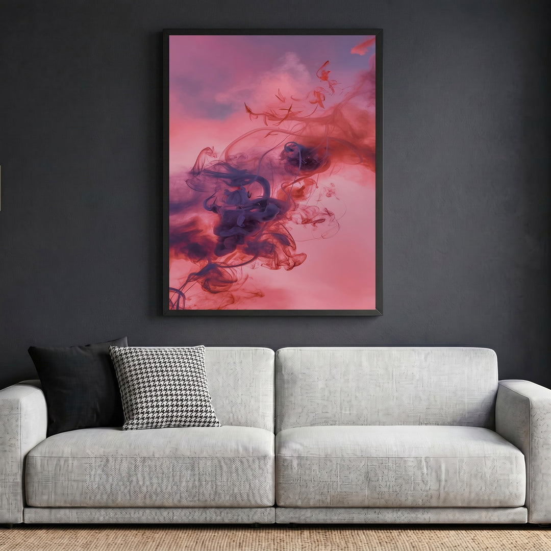 Wadi Home framed abstract smoke wall art with violet and crimson swirls displayed above a modern grey sofa.