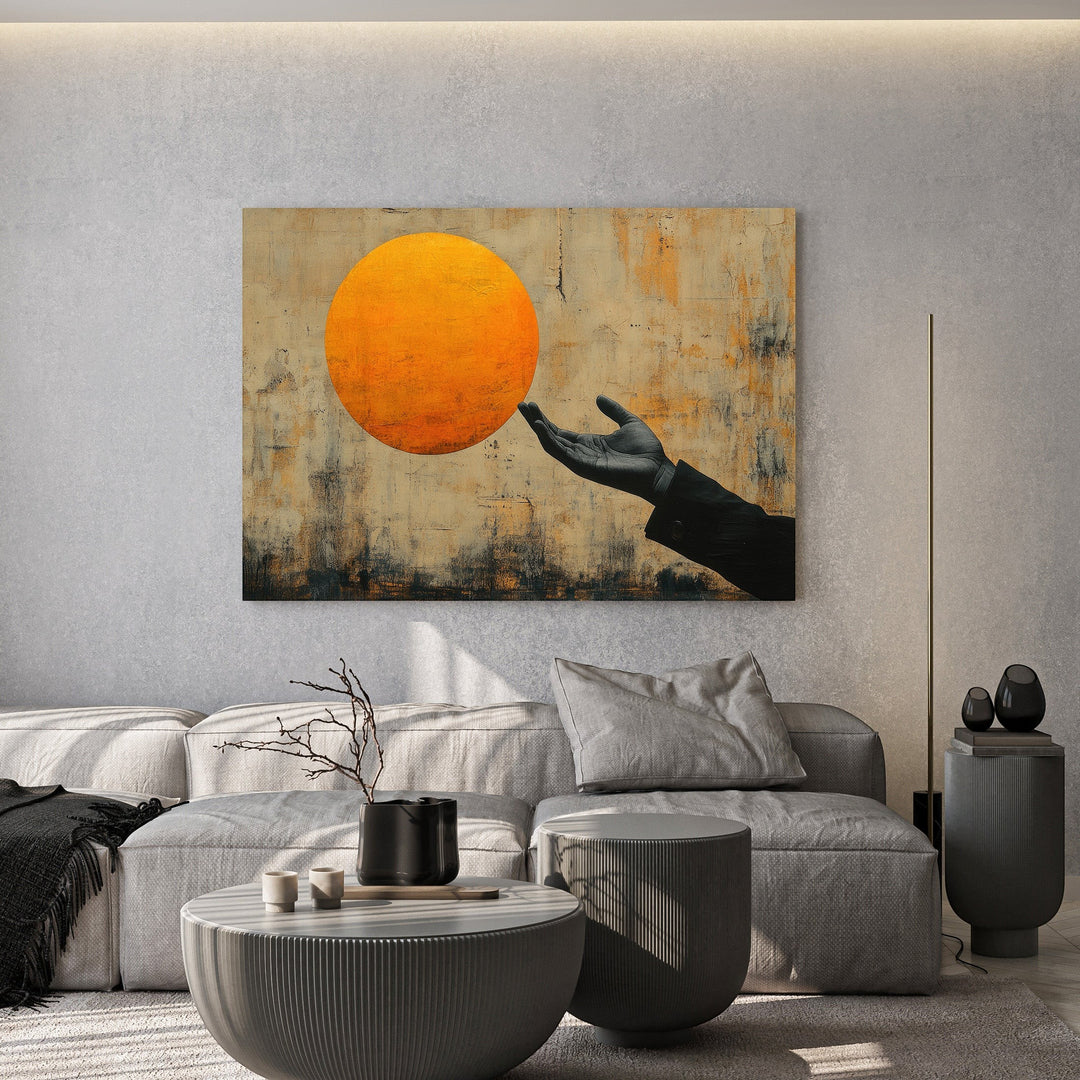 Wadi Home abstract wall art featuring a hand reaching for a glowing sun on a textured background in a modern living room