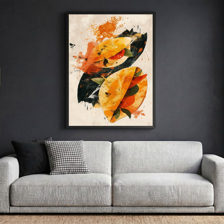 Wadi Home abstract taco illustration wall art in a black frame hanging above a modern grey sofa.