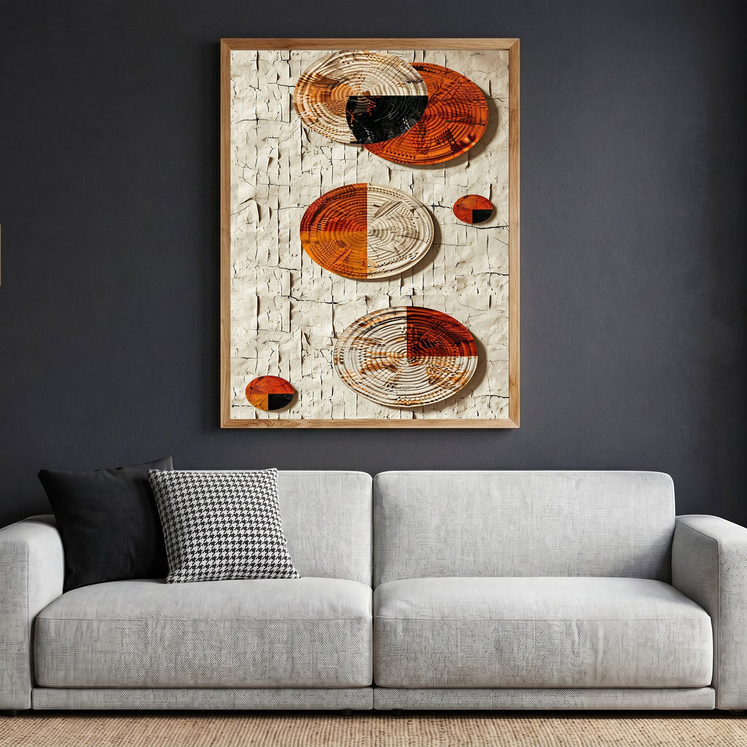 Wadi Home abstract textured wall art featuring woven circular elements in terracotta, cream, and black on a plaster background.