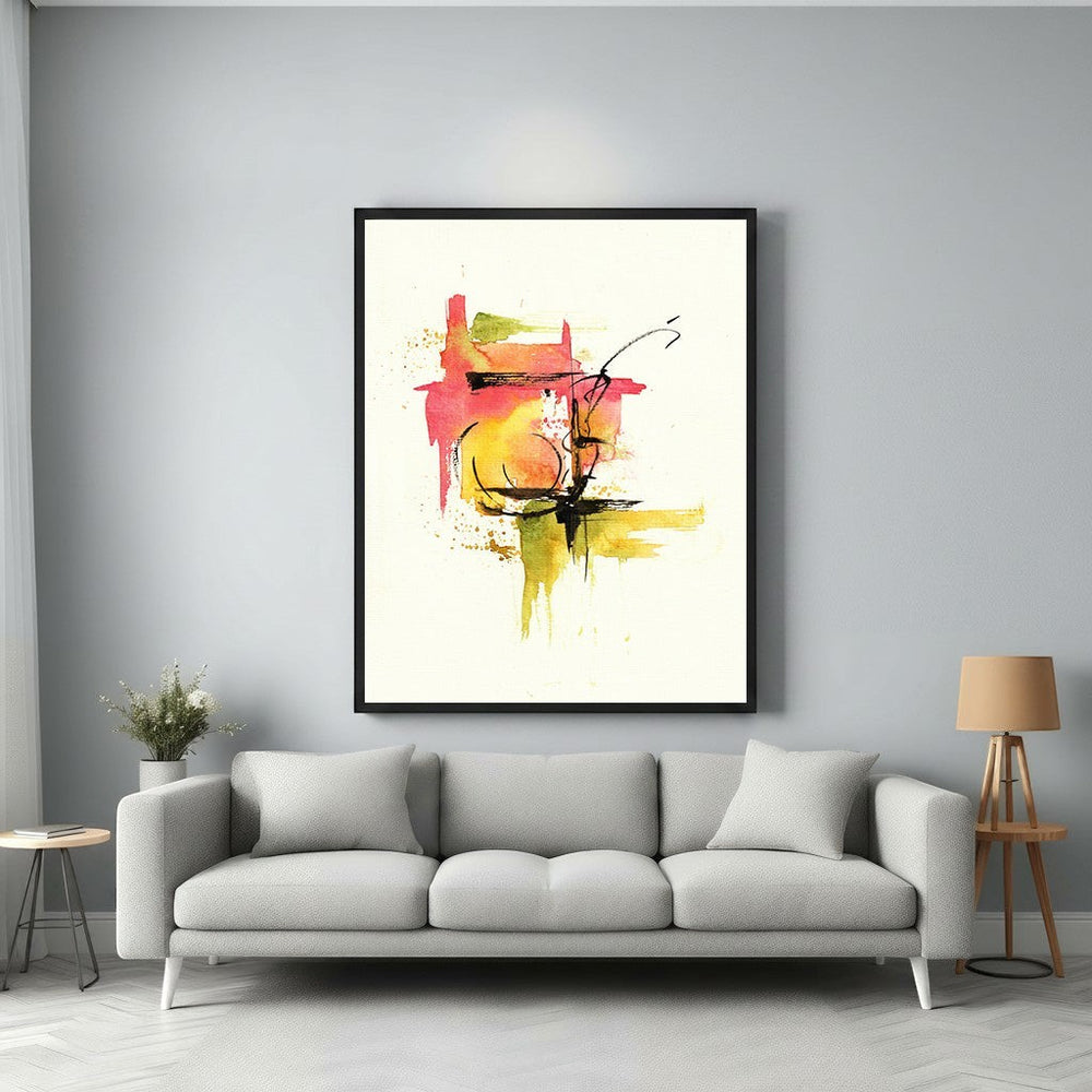 Wadi Home abstract watercolor wall art with red, yellow, green splashes and black lines. Framed art above a grey sofa.