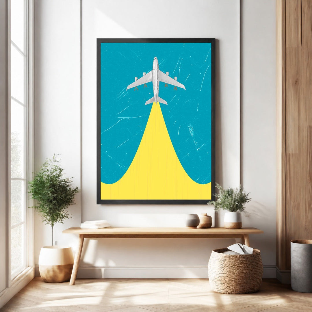 Wadi Home framed airplane ascending artwork with yellow plume against a blue textured background.