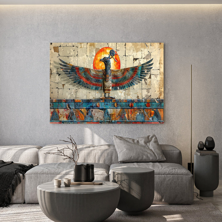 Wadi Home Ancient Egyptian style wall art featuring a winged deity and glowing sun above a modern grey living room sofa