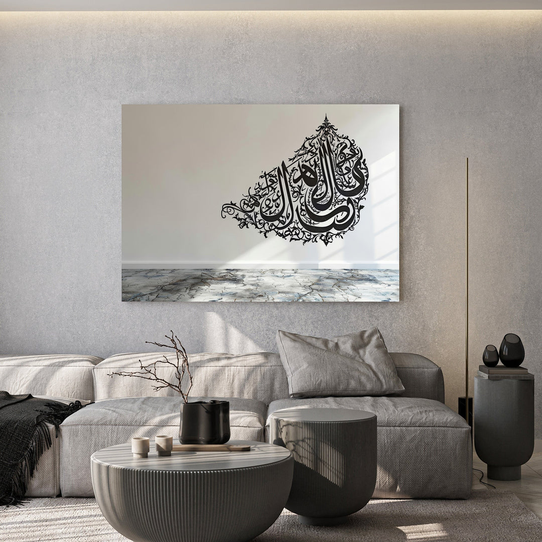 Wadi Home decorative wall art featuring intricate black Arabic calligraphy displayed in a modern minimalist living room.