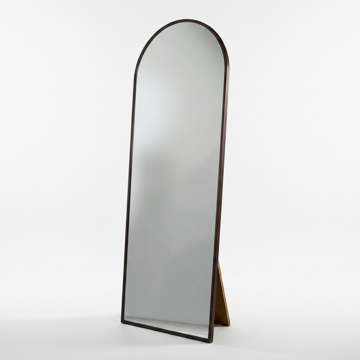 Wadi Home arched floor standing full length mirror with a dark wood frame and integrated support stand