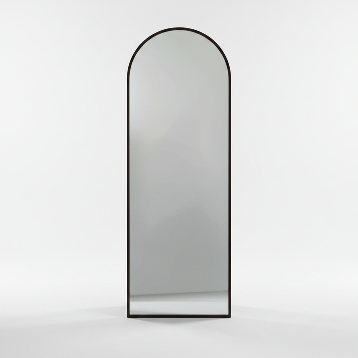 Wadi Home arched full length floor mirror with a dark wood frame standing against a plain white background