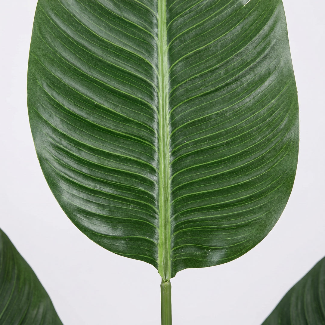 Wadi Home large green artificial banana leaf with prominent veins and a central stem.