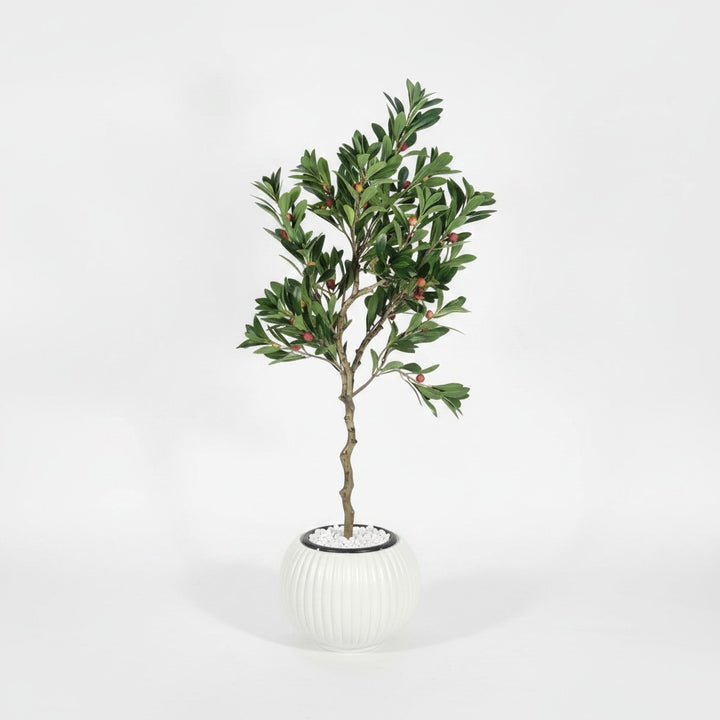 Wadi Home artificial berry tree with green foliage and red berries in a ribbed white ceramic pot with stone base