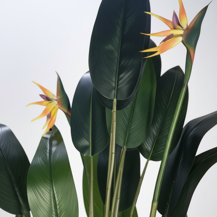 Wadi Home artificial Bird of Paradise plant with lush green leaves and vibrant orange and purple tropical blooms