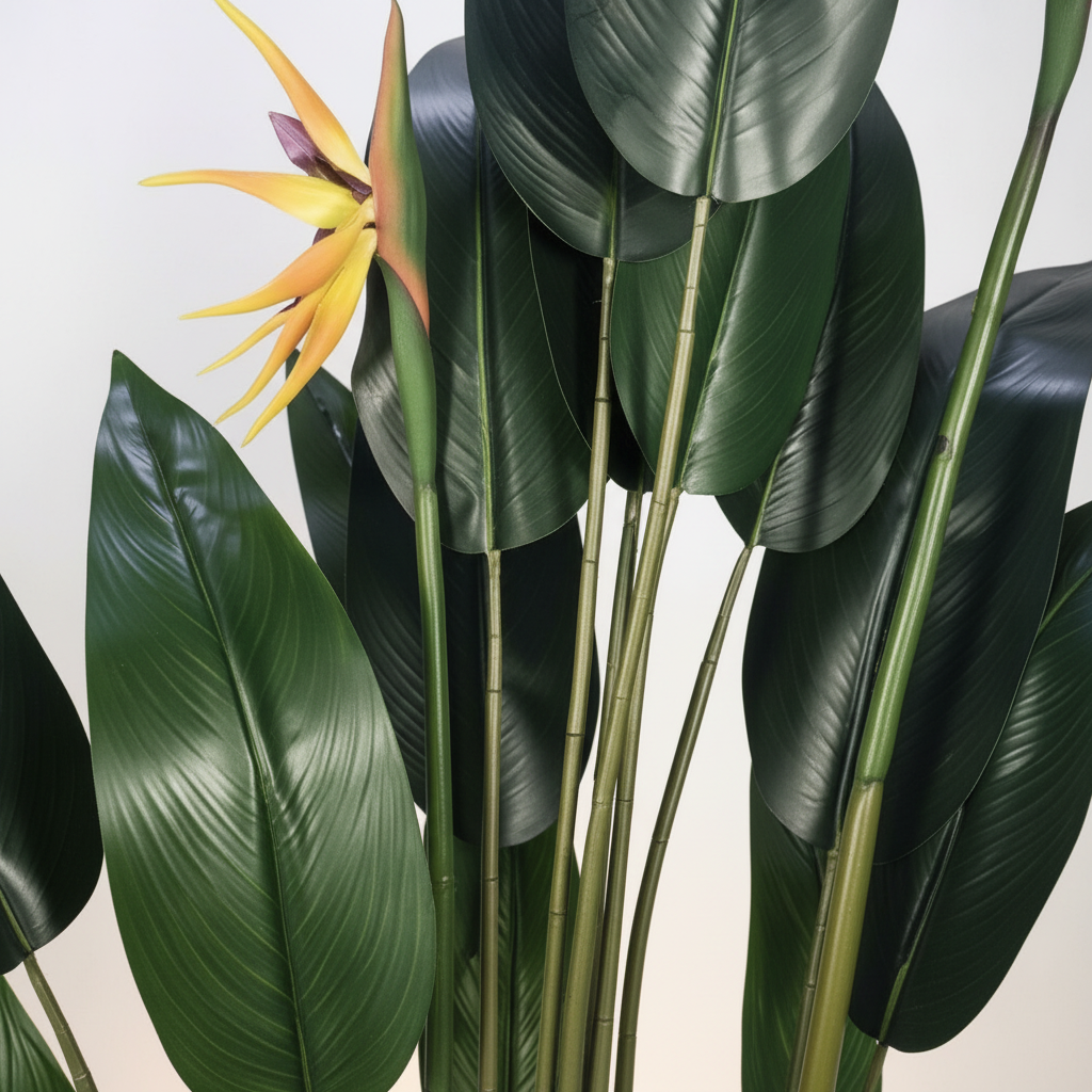 Wadi Home artificial Bird of Paradise plant with lush green leaves and vibrant orange and yellow tropical flowers