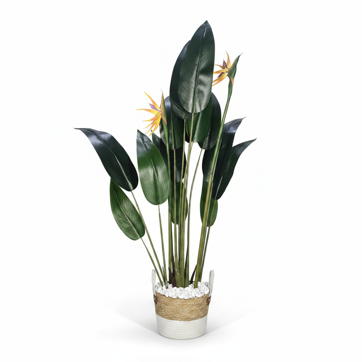 Wadi Home artificial Bird of Paradise plant with lush green leaves and orange blooms in a two-tone woven basket.