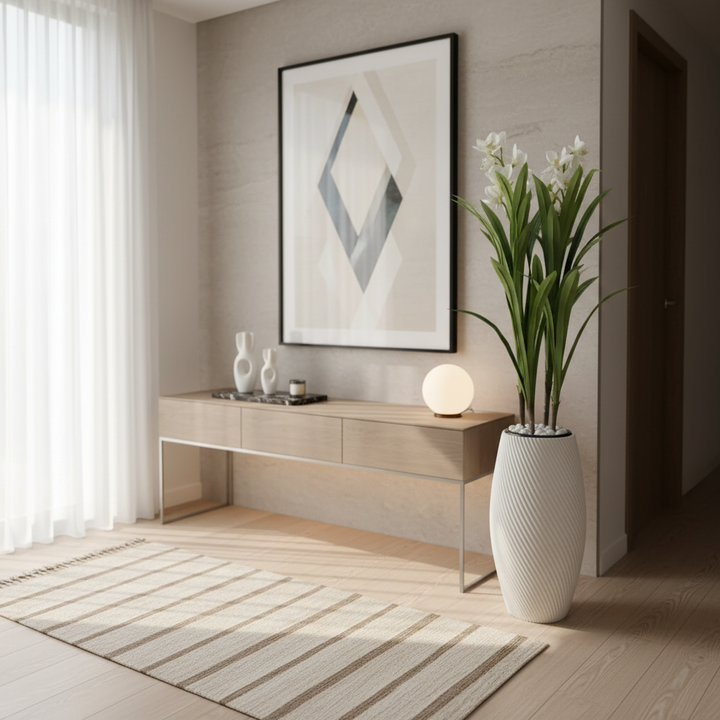 Wadi Home artificial dracaena plant with white blooms in a textured white spiral floor vase in a modern living room