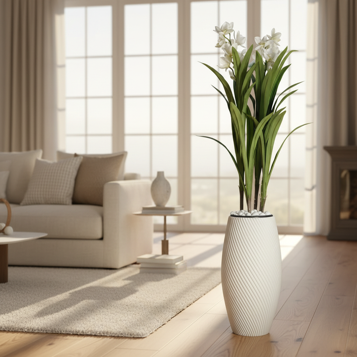 Wadi Home artificial dracaena plant with white flowers in a textured spiral white floor vase on a wooden floor.