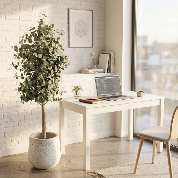 Wadi Home Artificial Eucalyptus Tree with silvery-green leaves and white buds in a textured pot, placed in a home office setting.