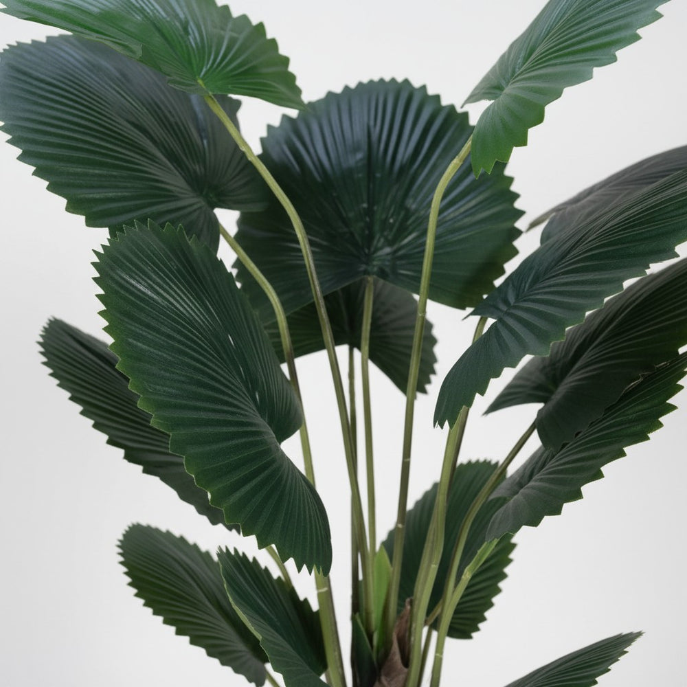 Wadi Home artificial fan palm plant with deep green textured leaves, perfect for modern home decor.