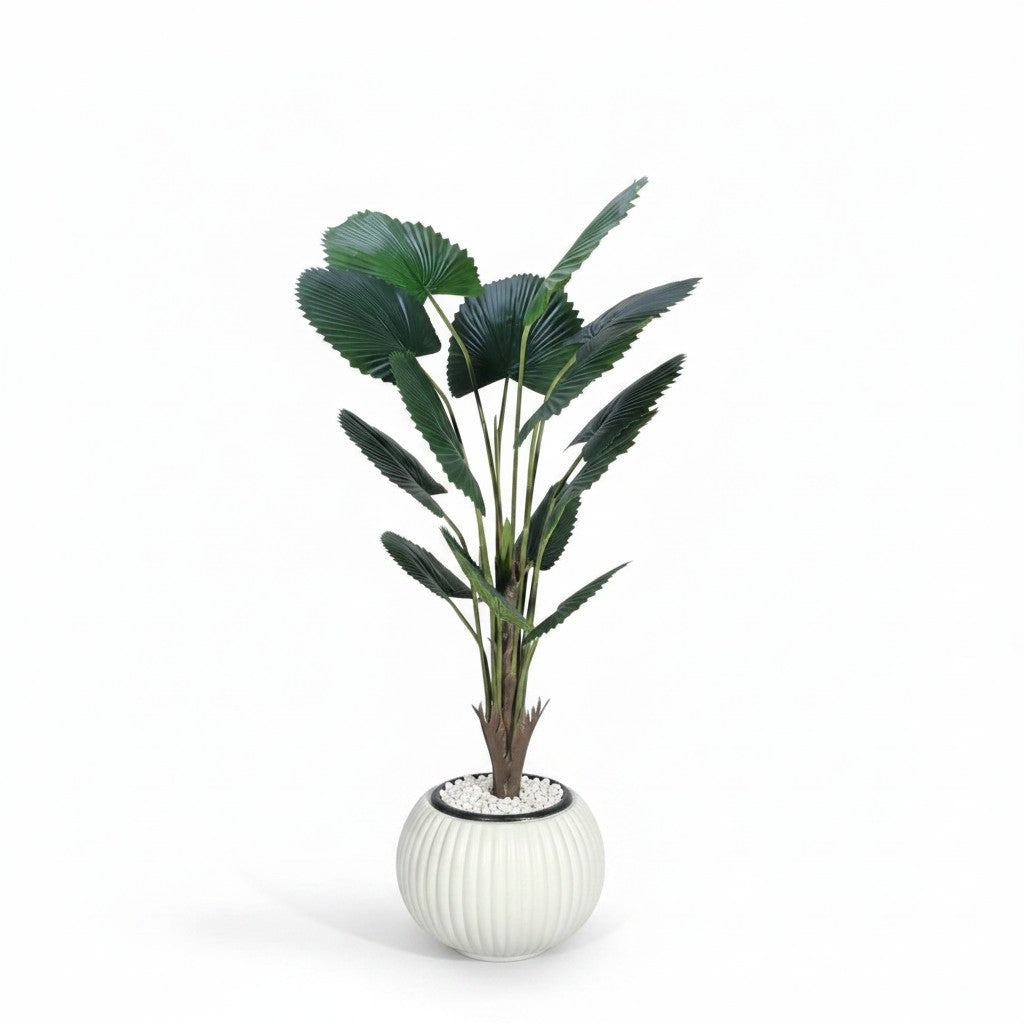 Wadi Home artificial fan palm plant with deep green leaves in a modern white ribbed ceramic pot with white pebbles