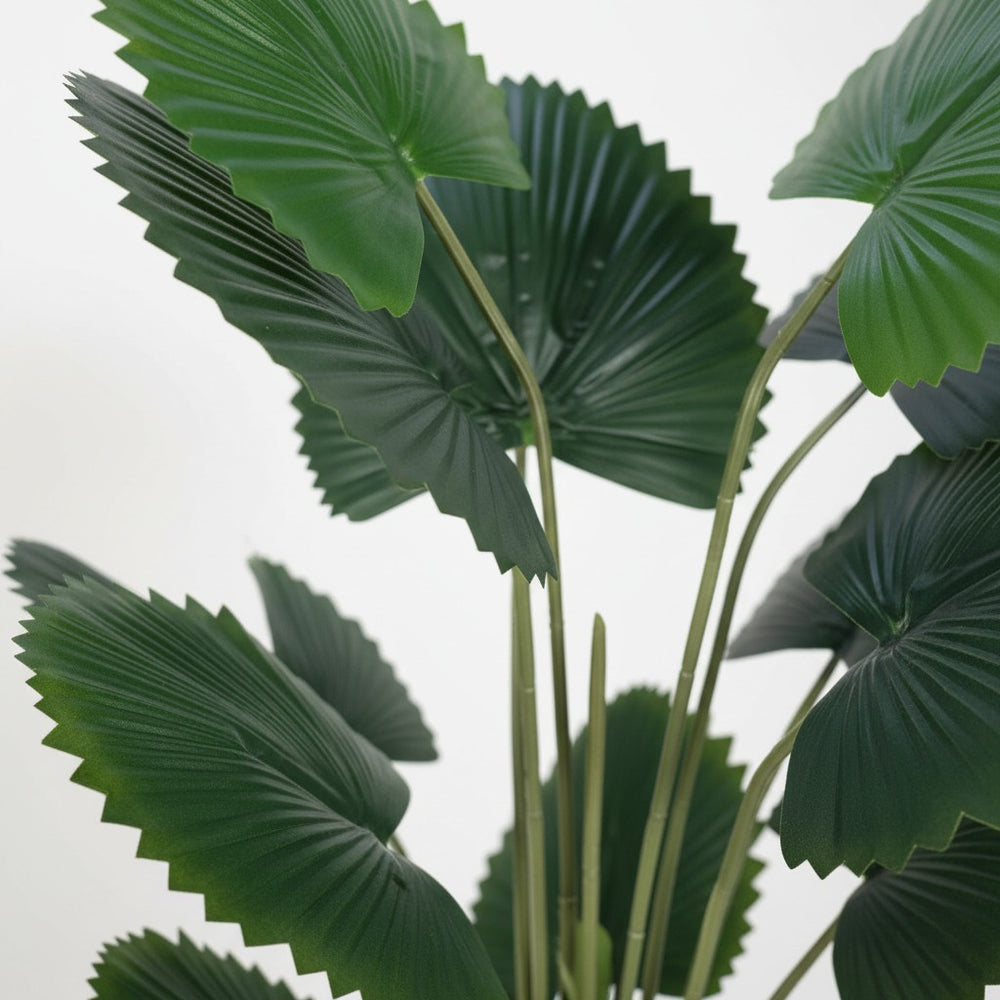 Wadi Home artificial fan palm plant with vibrant deep green pleated leaves against a clean white background