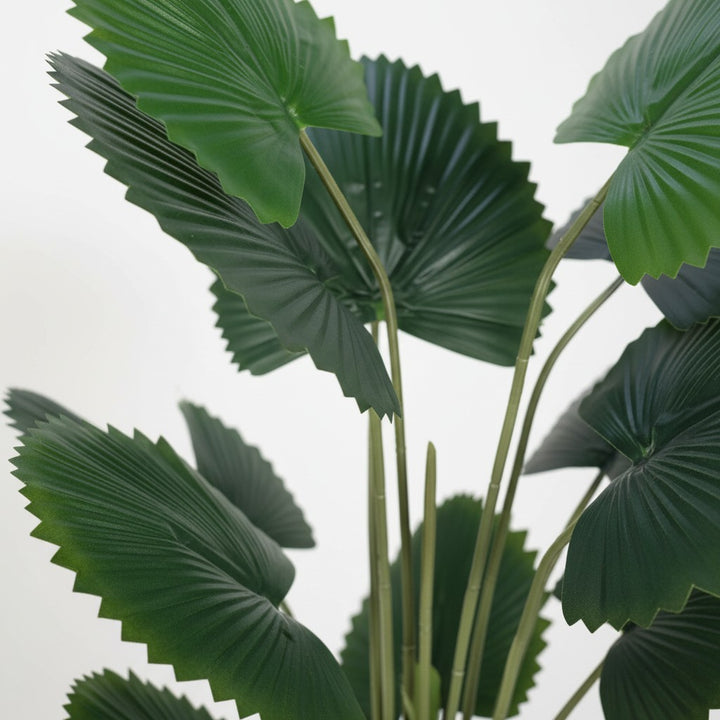 Wadi Home artificial fan palm plant with vibrant deep green pleated leaves against a clean white background