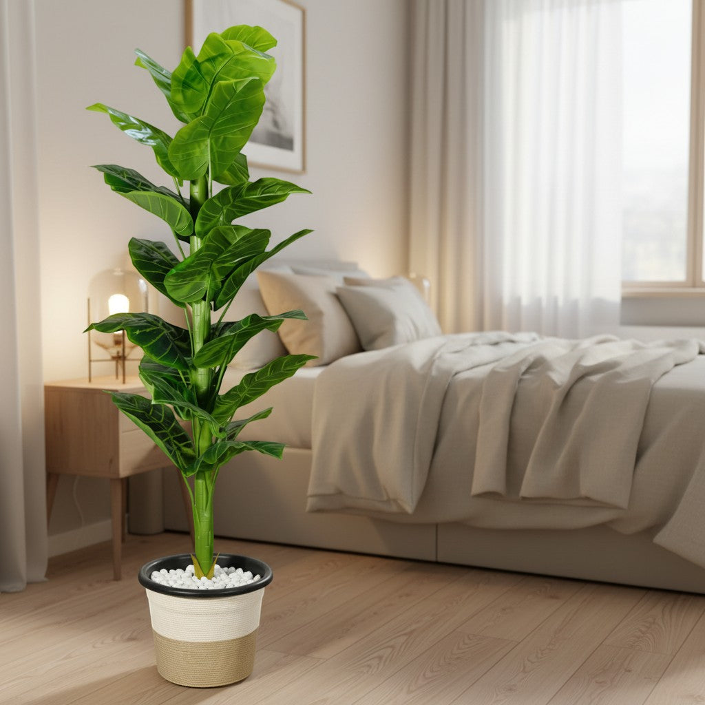 Wadi Home artificial fiddle leaf fig plant with vibrant green leaves in a two-tone textured pot in a bedroom.