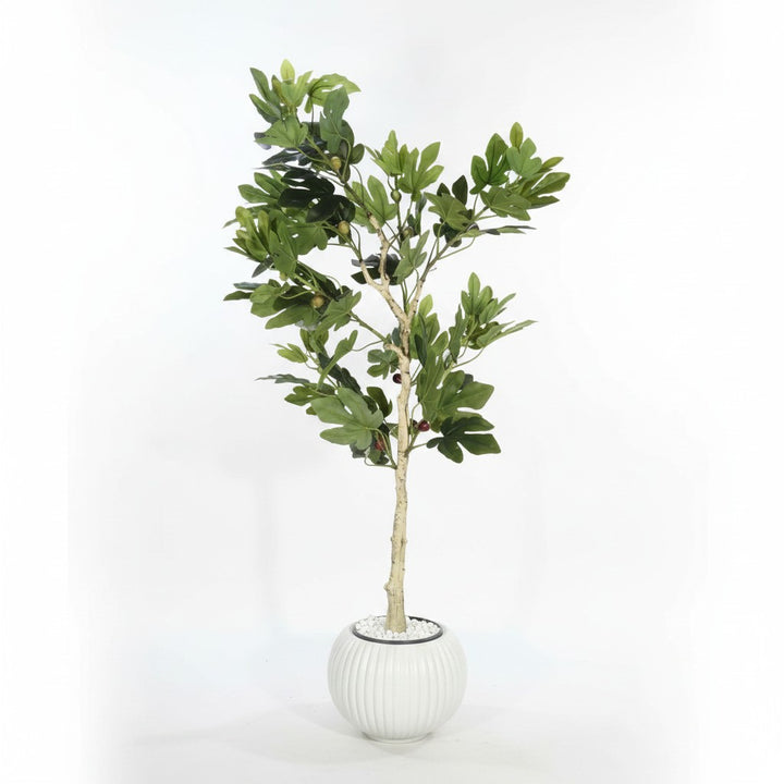 Wadi Home artificial fig tree with vibrant green leaves and fruit in a ribbed white planter with decorative pebbles.