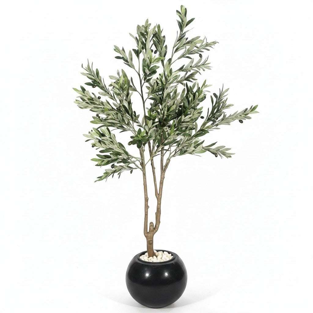 Wadi Home artificial olive tree with green leaves and black olives in a round black planter with white stones.