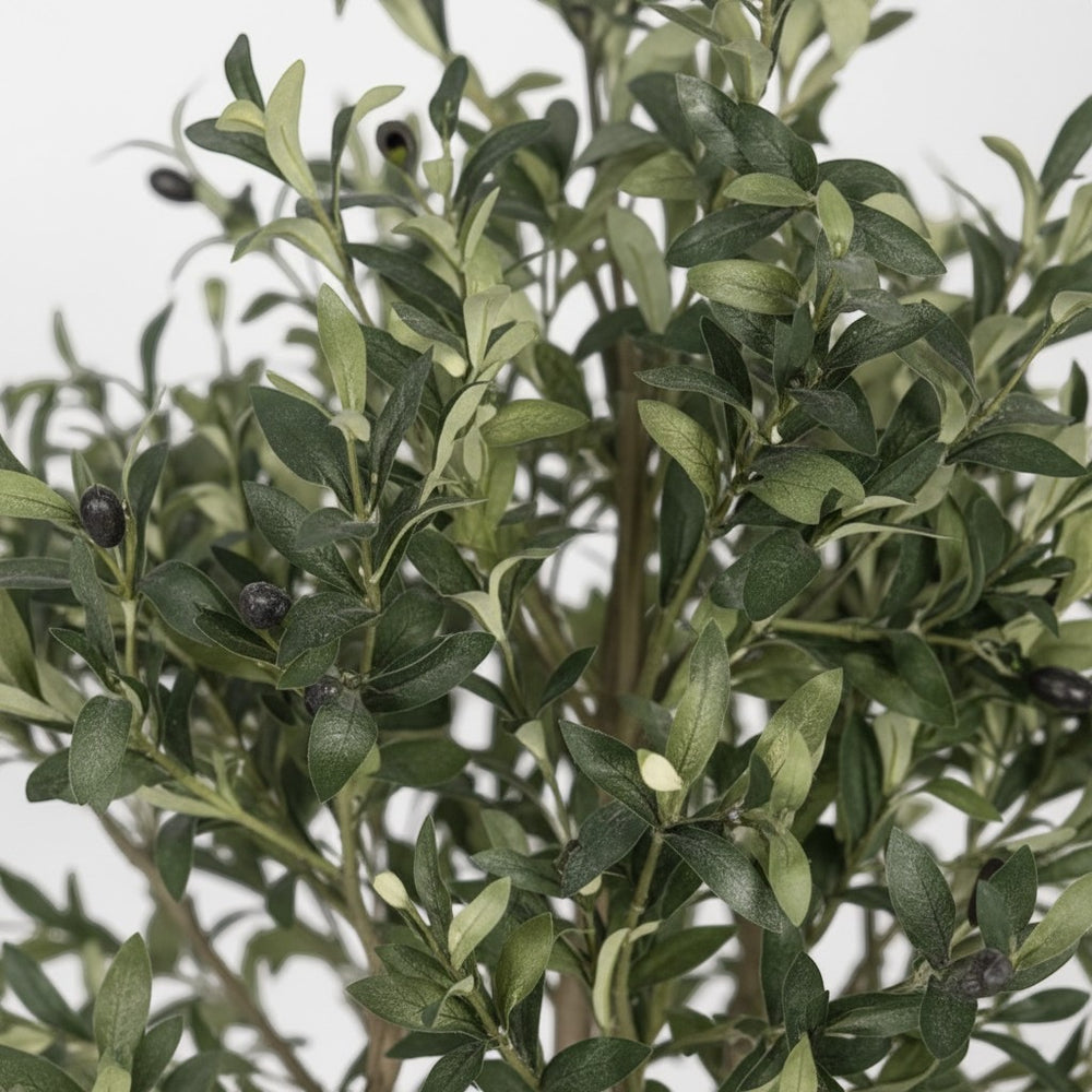 Wadi Home artificial olive tree featuring realistic green leaves and small dark olives on a textured branch