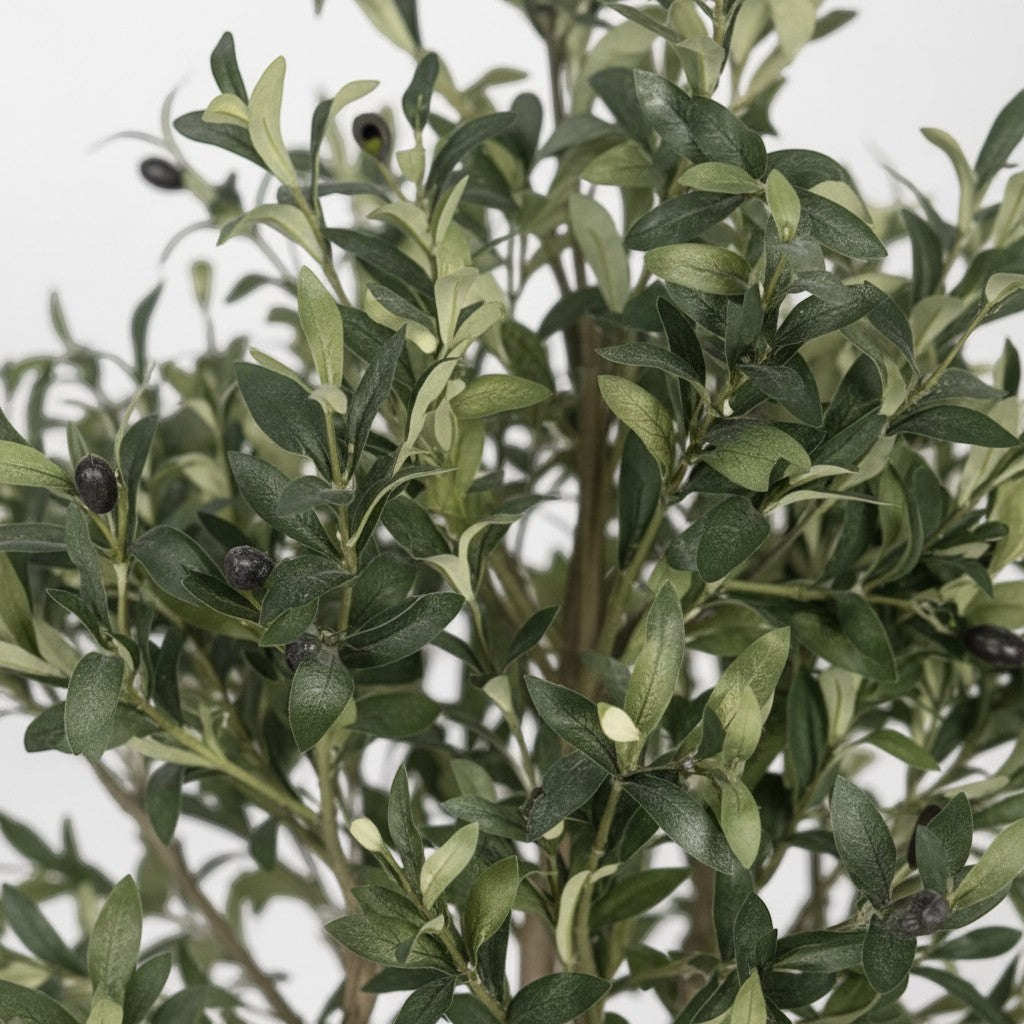 Wadi Home artificial olive tree featuring realistic green leaves and small dark olives on a textured branch