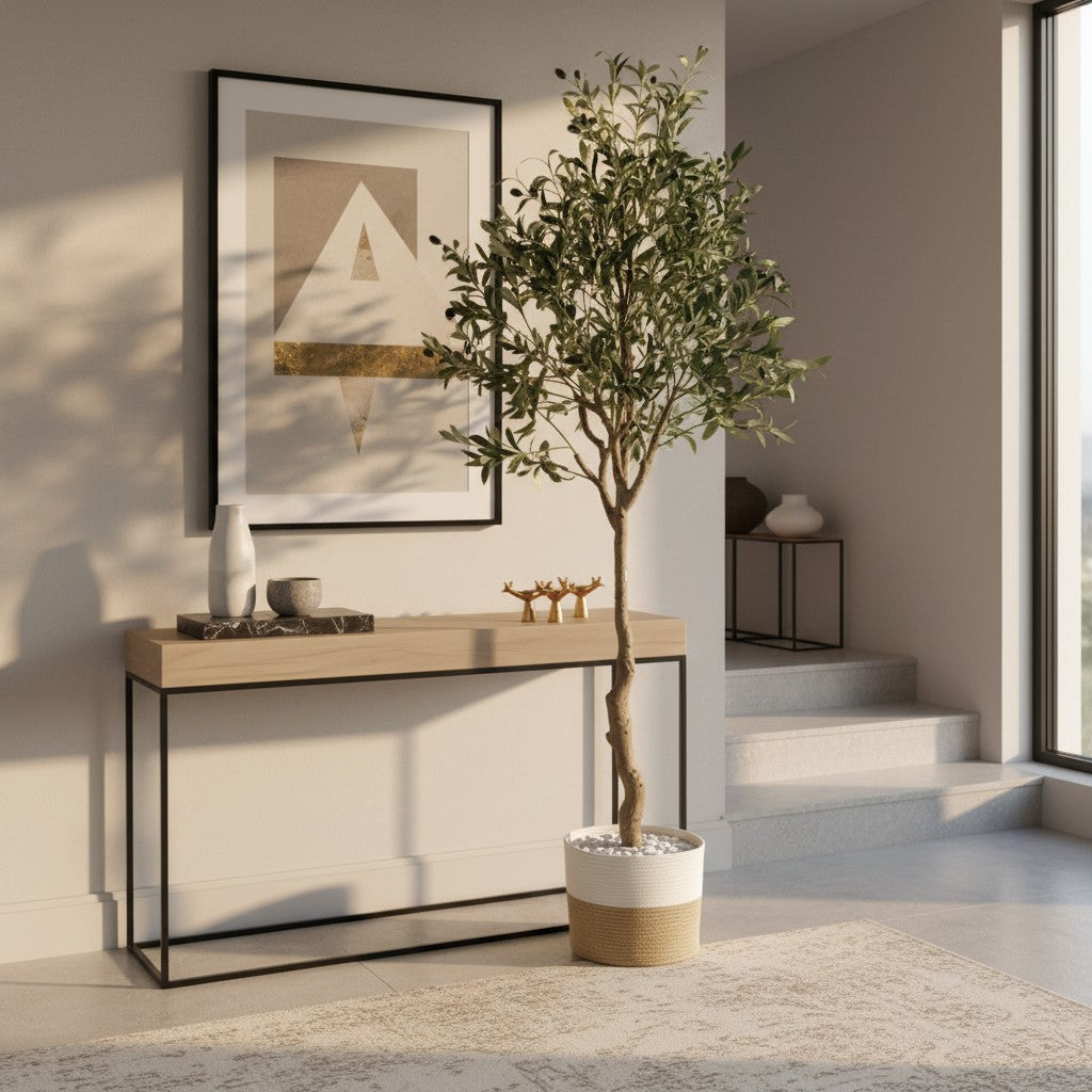 Wadi Home artificial olive tree with gnarled trunk and silvery-green leaves in a decorative jute-wrapped pot.