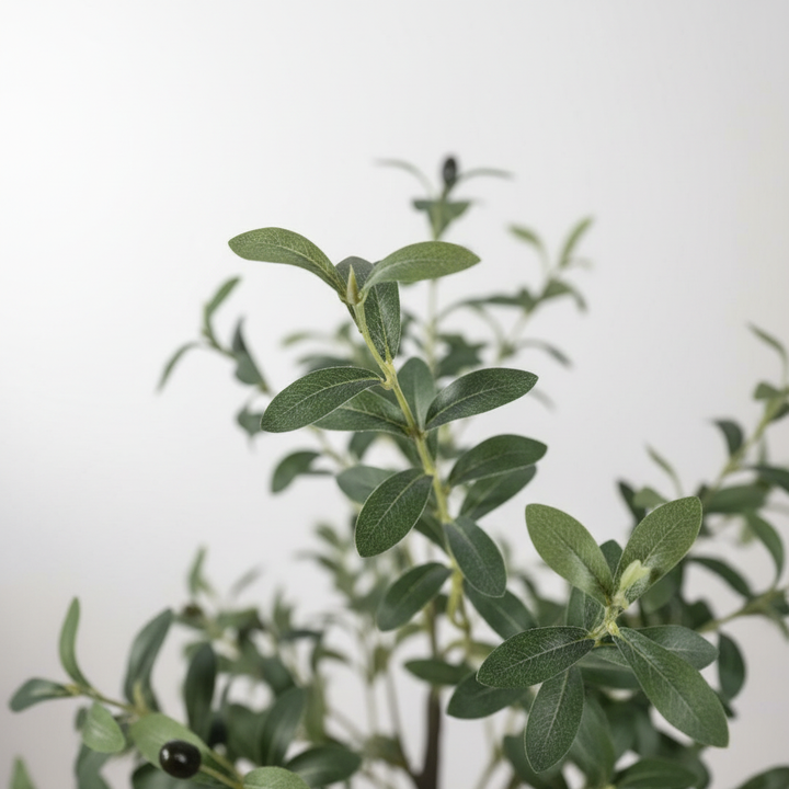Wadi Home artificial olive tree featuring realistic silvery-green leaves and small black olives on slender branches