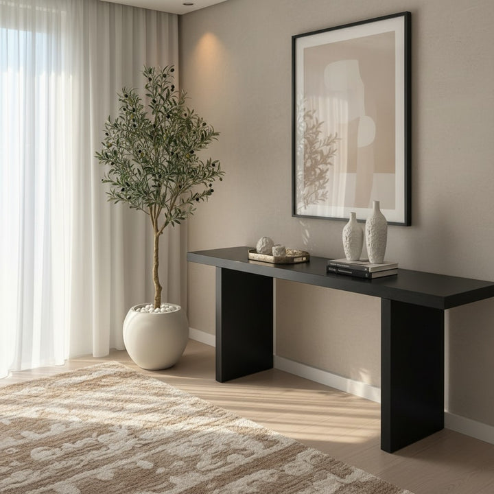 Wadi Home artificial olive tree with realistic foliage and olives in a white pot, styled in a modern living room.