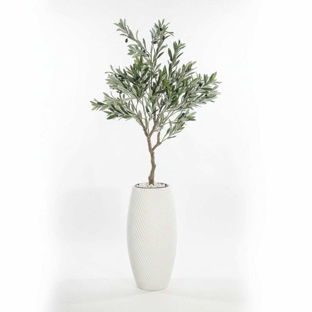 Wadi Home artificial olive tree with green leaves and black olives in a white textured planter with white stones.