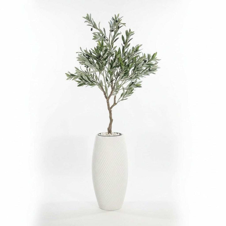 Wadi Home artificial olive tree with green leaves and black olives in a white textured planter with white stones.