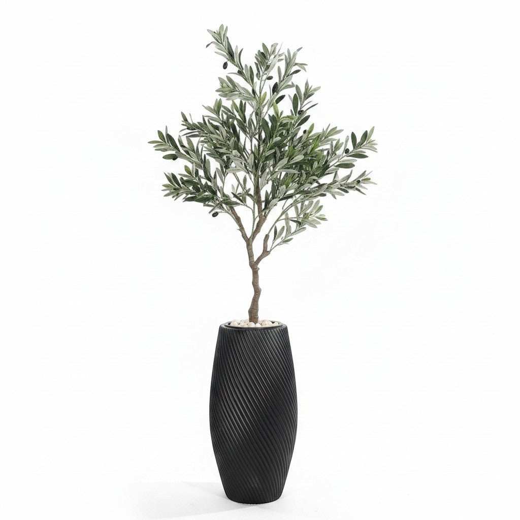 Wadi Home artificial olive tree with green leaves and black olives in a textured black planter with white stones.