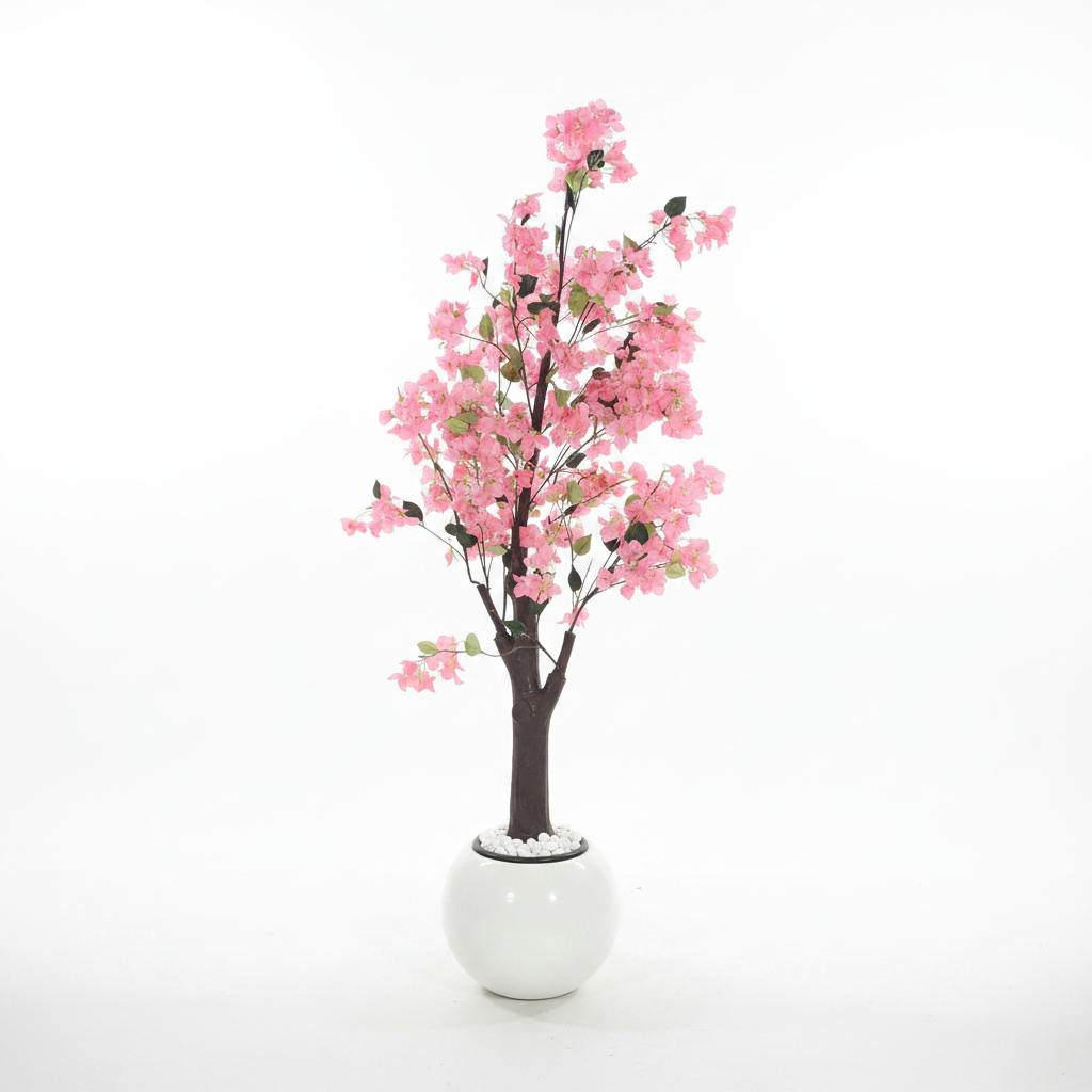 Wadi Home artificial pink blossom tree in a modern white spherical pot with decorative white pebbles at the base