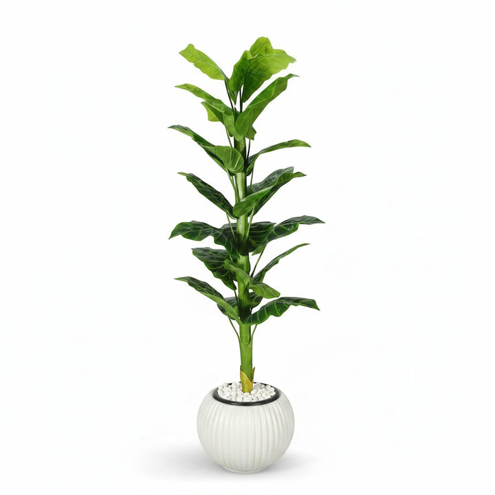 Wadi Home artificial floor plant with lush green leaves in a white ribbed decorative planter with pebble top layer