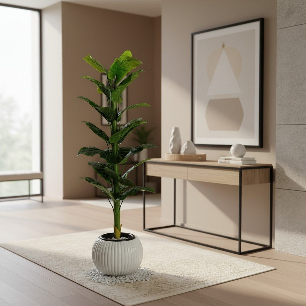 Wadi Home artificial floor plant with lush green leaves in a white ribbed decorative planter on a neutral rug