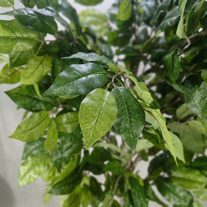 Wadi Home artificial potted tree with realistic green leaves and detailed textures for indoor home decor.