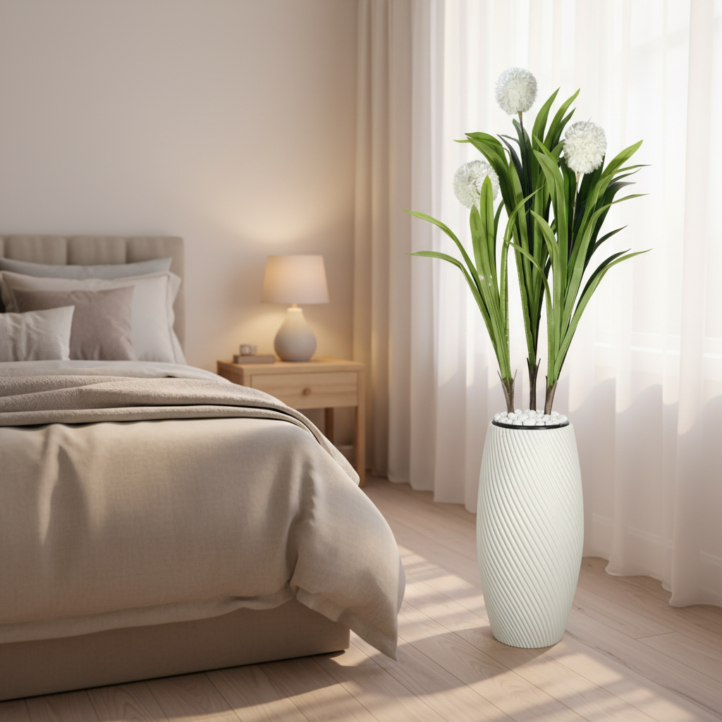 Wadi Home artificial yucca plant with green leaves and white flowers in a textured spiral white floor vase in a bedroom