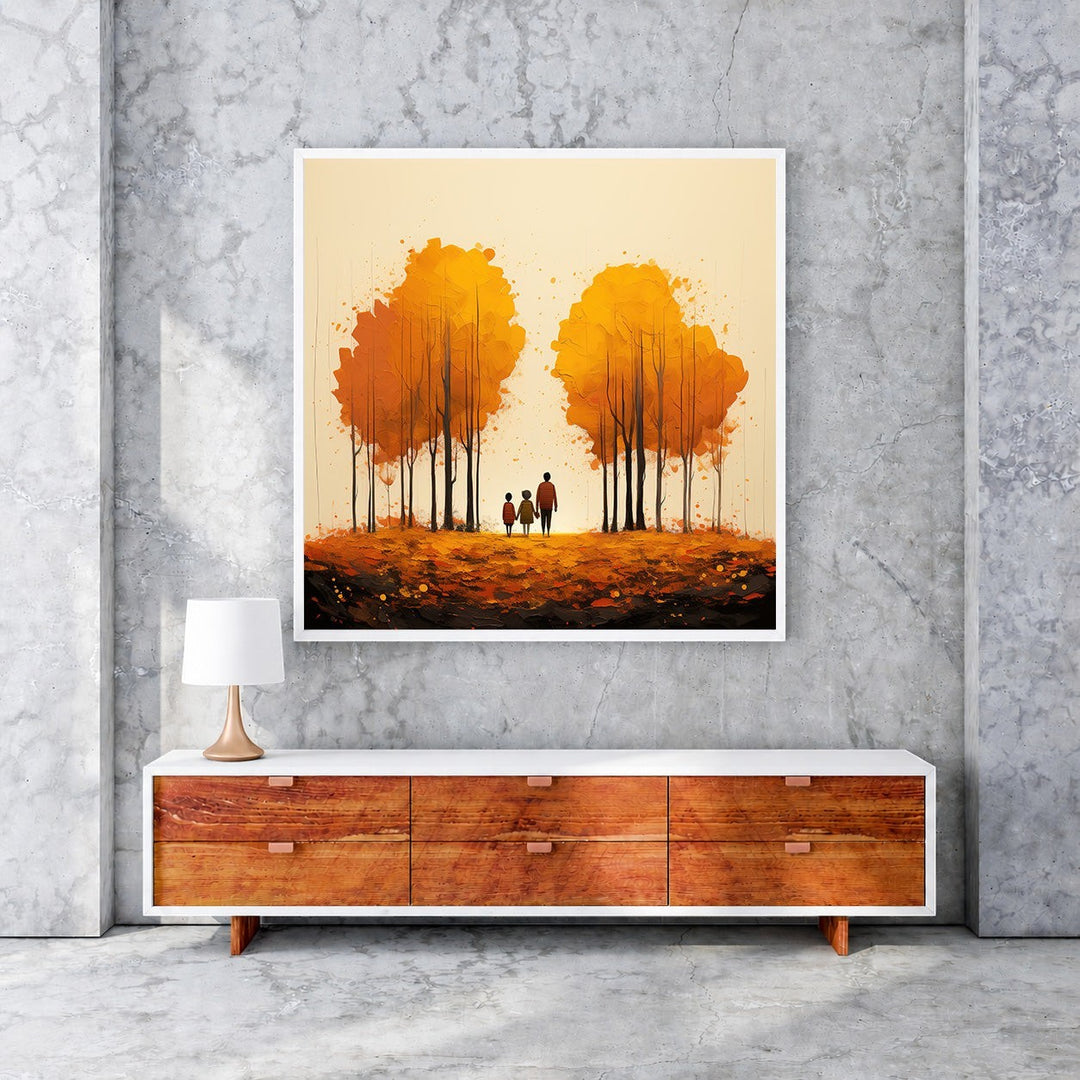 Wadi Home autumn trees wall art with family silhouette walking on fallen leaves. Warm orange and yellow tones.
