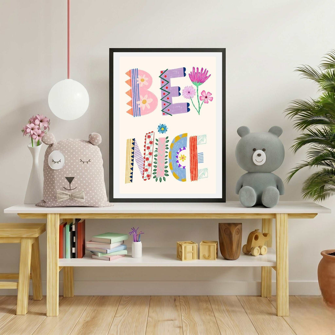 Wadi Home framed art print with colorful, patterned letters spelling "BE NICE" with floral accents, ideal for a child's room.