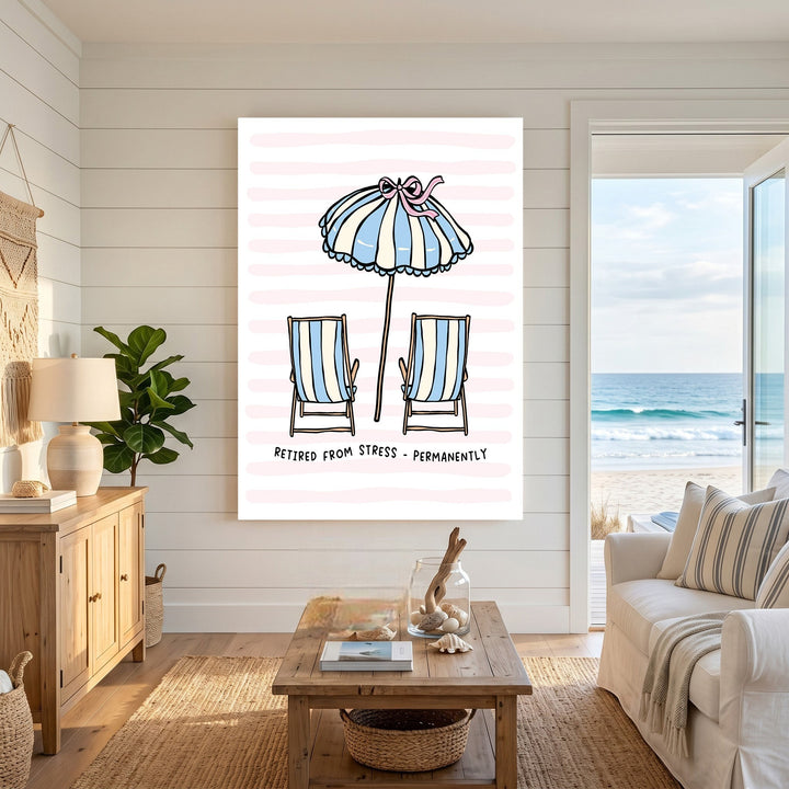 Wadi Home beach themed wall art featuring striped chairs and umbrella on a pink striped background in a coastal room.