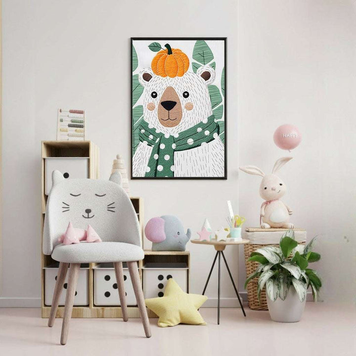Wadi Home framed wall art of a white bear wearing a green polka dot scarf and an orange pumpkin hat, surrounded by green leaves.