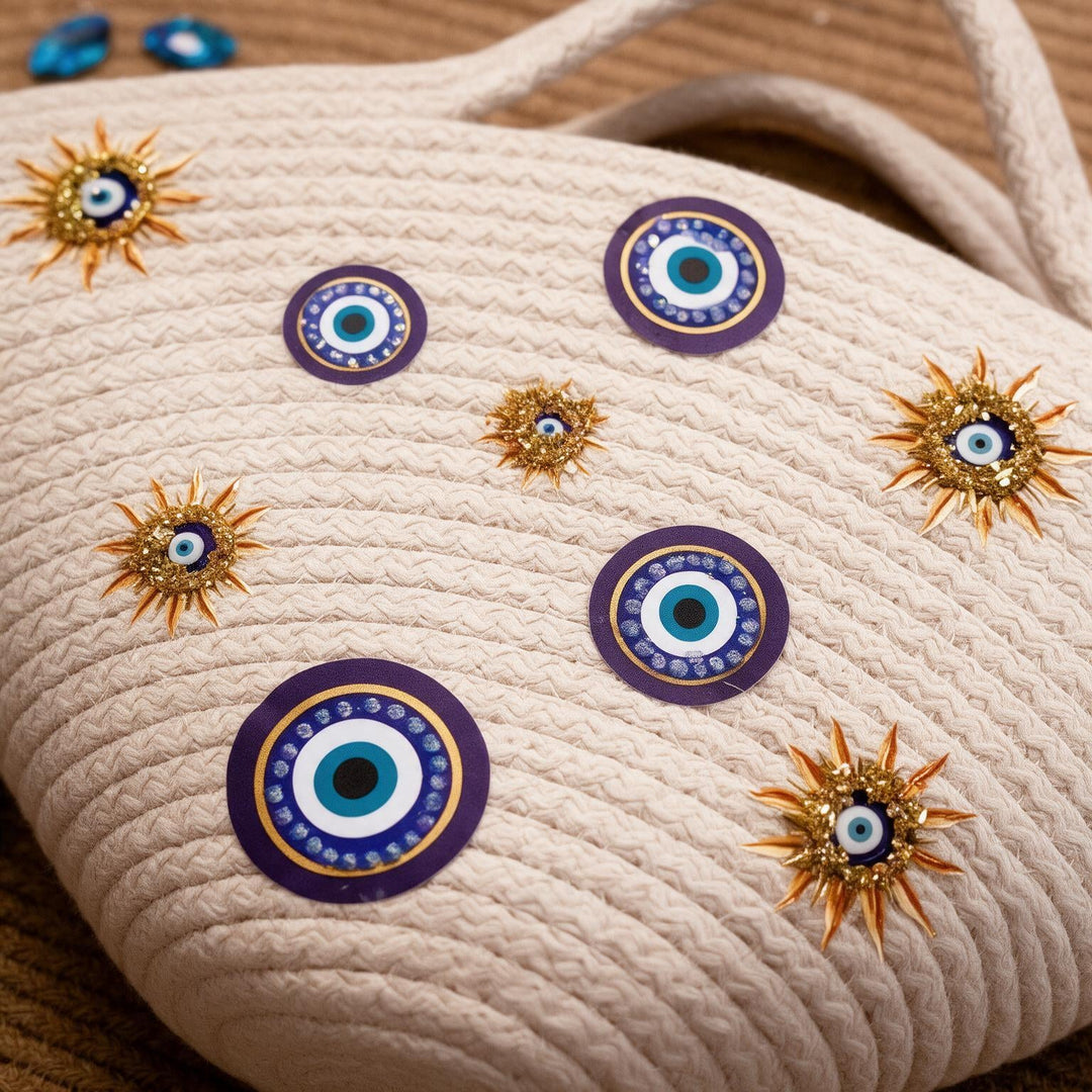 Wadi Home beige rope tote handbag featuring evil-eye motifs and sun-inspired gold embellishments for a summer look.